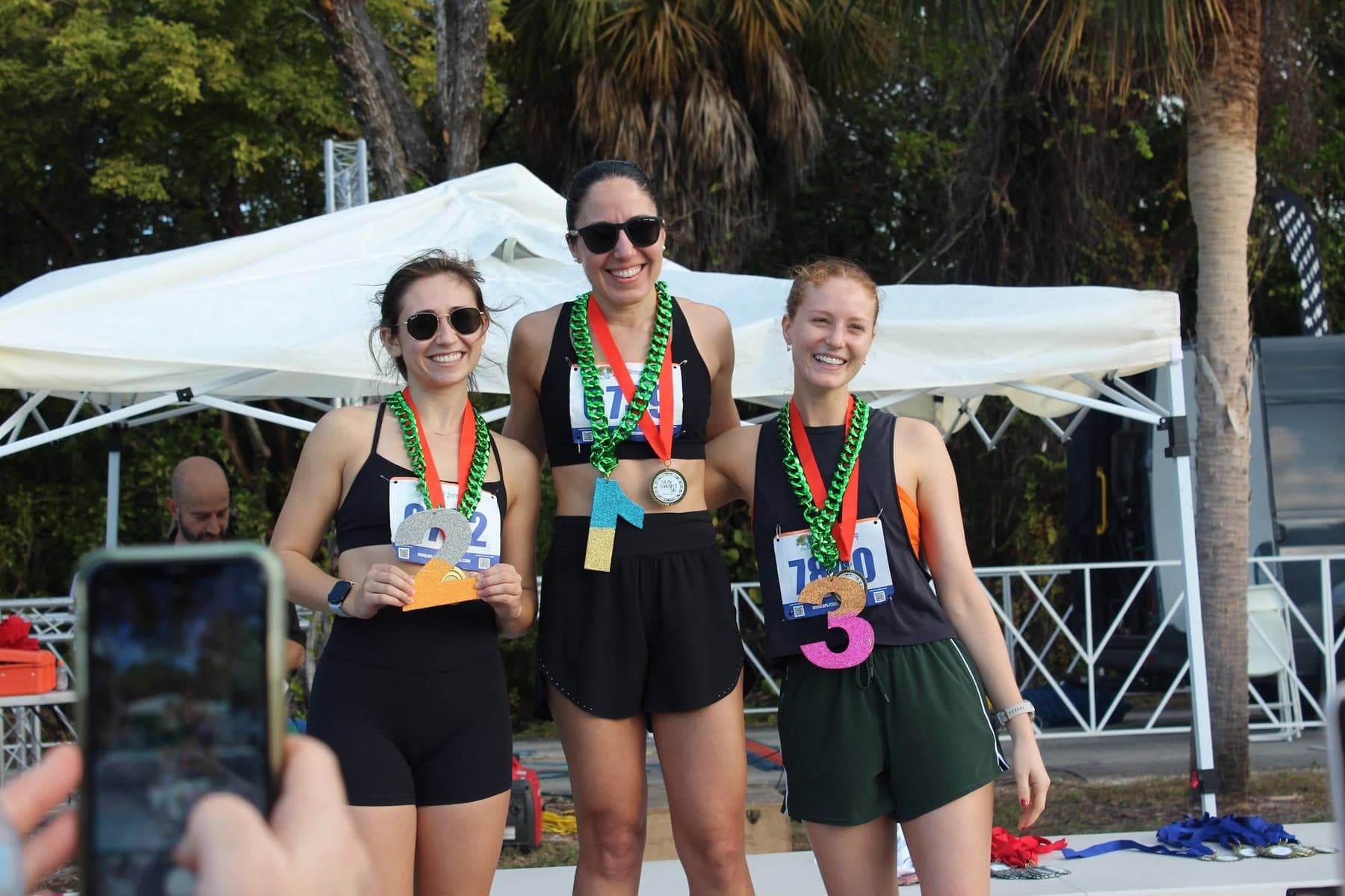 Age group winners holding their awards