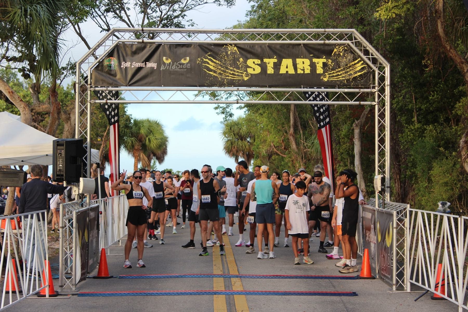 Runners charging through the SunSmart start arch